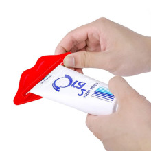 Prensa Tubo Pasta Dental Labios Rojos